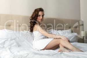 Charming woman relaxing in hotel room