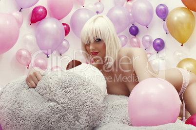 Studio photo of exciting platinum blonde posing