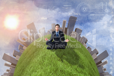 Composite image of calm businessman sitting in lotus pose