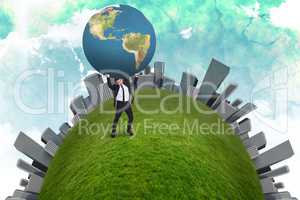 Composite image of businessman carrying the world