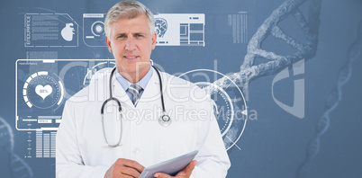 Doctor looking at camera and holding tablet