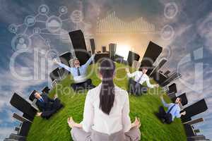 Businesswoman sitting in lotus pose