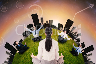 Businesswoman sitting in lotus pose