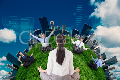 Businesswoman sitting in lotus pose