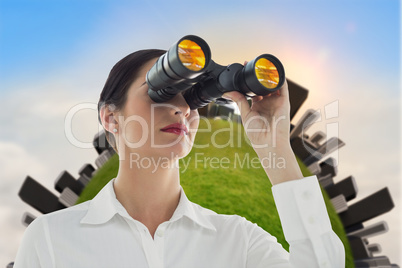 Business woman  looking through binoculars