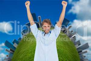 Happy man celebrating success with arms up