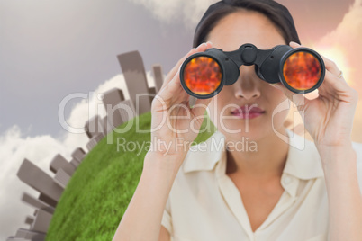 Closeup of a businesswoman looking through binoculars