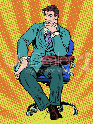 thoughtful businessman sitting in chair