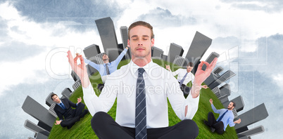 Composite image of businessman meditating in lotus pose