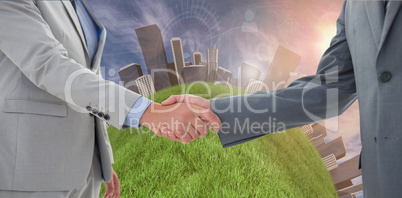 Composite image of businessman sitting on the floor cheering