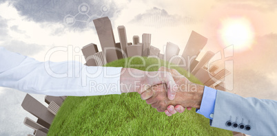 Composite image of businessman sitting on the floor cheering