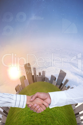 Composite image of business people shaking hands