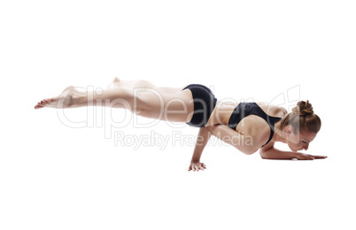 Flexible woman posing in difficult strength pose
