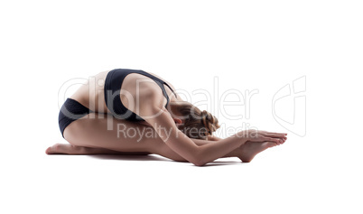 Flexible woman posing in studio, isolated on white