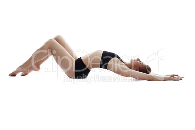 Graceful athletic girl lying in studio