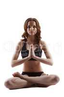 Pretty teenage girl posing in lotus posture