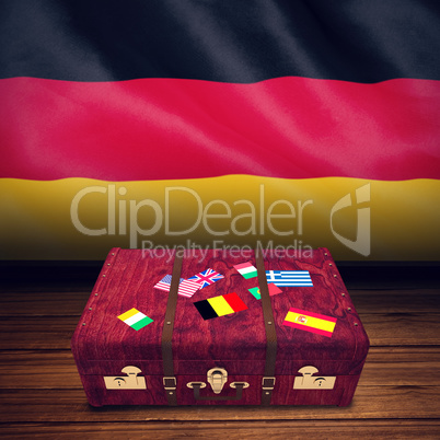 Composite image of suitcase with stickers