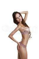 Pretty slender brunette posing in erotic lingerie