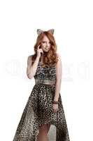 Charming red-haired girl posing in catwoman outfit