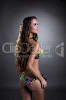Attractive glamorous brunette posing in swimsuit
