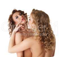 Beautiful curly girls caress each other at camera