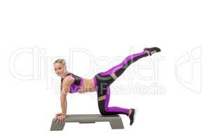 Image of lovely young girl exercising on stepper