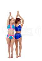 Beautiful girls practicing fitness in paired