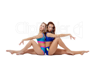 Charming female athletes posing looking at camera