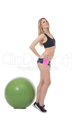 Flirtatious fitness girl posing at camera