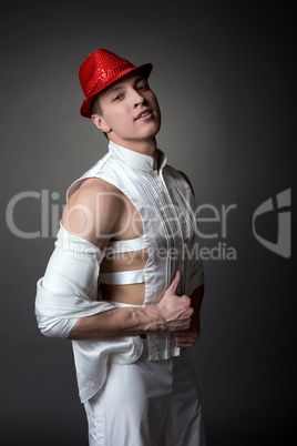 Handsome male dancer in elegant suit and hat