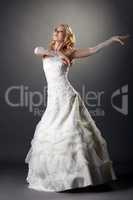 Lovely blonde bride dressed in elegant attire
