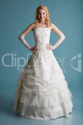 Image of smiling model touts elegant wedding dress