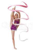 Charming artistic gymnast dancing with pink ribbon