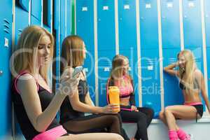 Athletic girls having fun in locker room