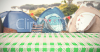 Composite image of white and green tablecloth