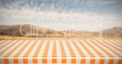 Composite image of orange and white tablecloth