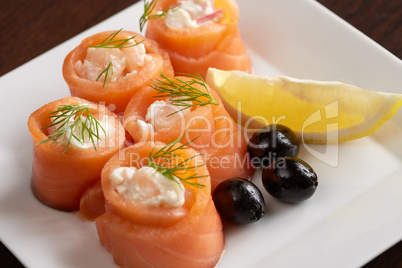 Close-up of salmon rolls with spicy sauce