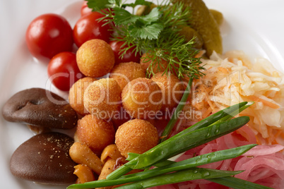 Close-up of cheese balls and pickled vegetables Close-up of cheese balls and pickled vegetables