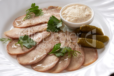 Cold meats, pickles and sauce. Restaurant food