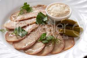 Cold meats, pickles and sauce. Restaurant food