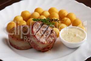 Delicious grilled meat with sauce and cheese balls