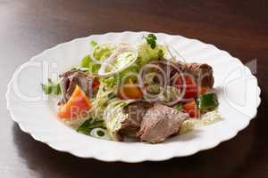 Delicious salad made of meat and vegetables