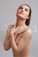 Seductive nude model hugged neck with hands