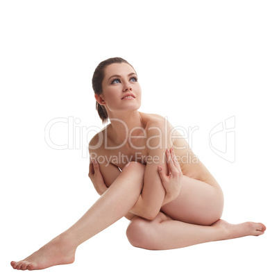 Concept of epilation. Nude woman hugging her leg