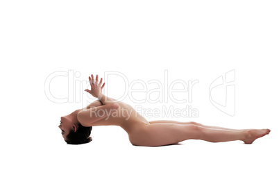 Side view of graceful naked girl doing yoga