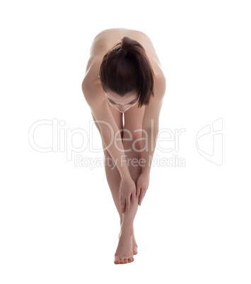 Studio shot of naked girl doing fitness exercise