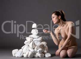 Telekinesis. Nude woman possesses power of thought