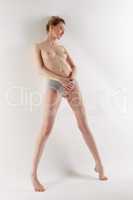 Image of leggy model posing naked to waist