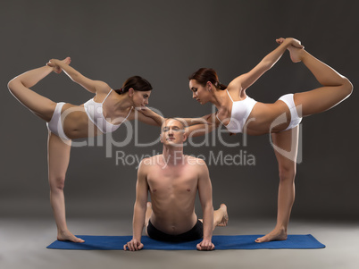 Yoga composition of flexible people posing