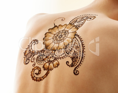 Mehndi. Complex pattern on back of model, close-up
